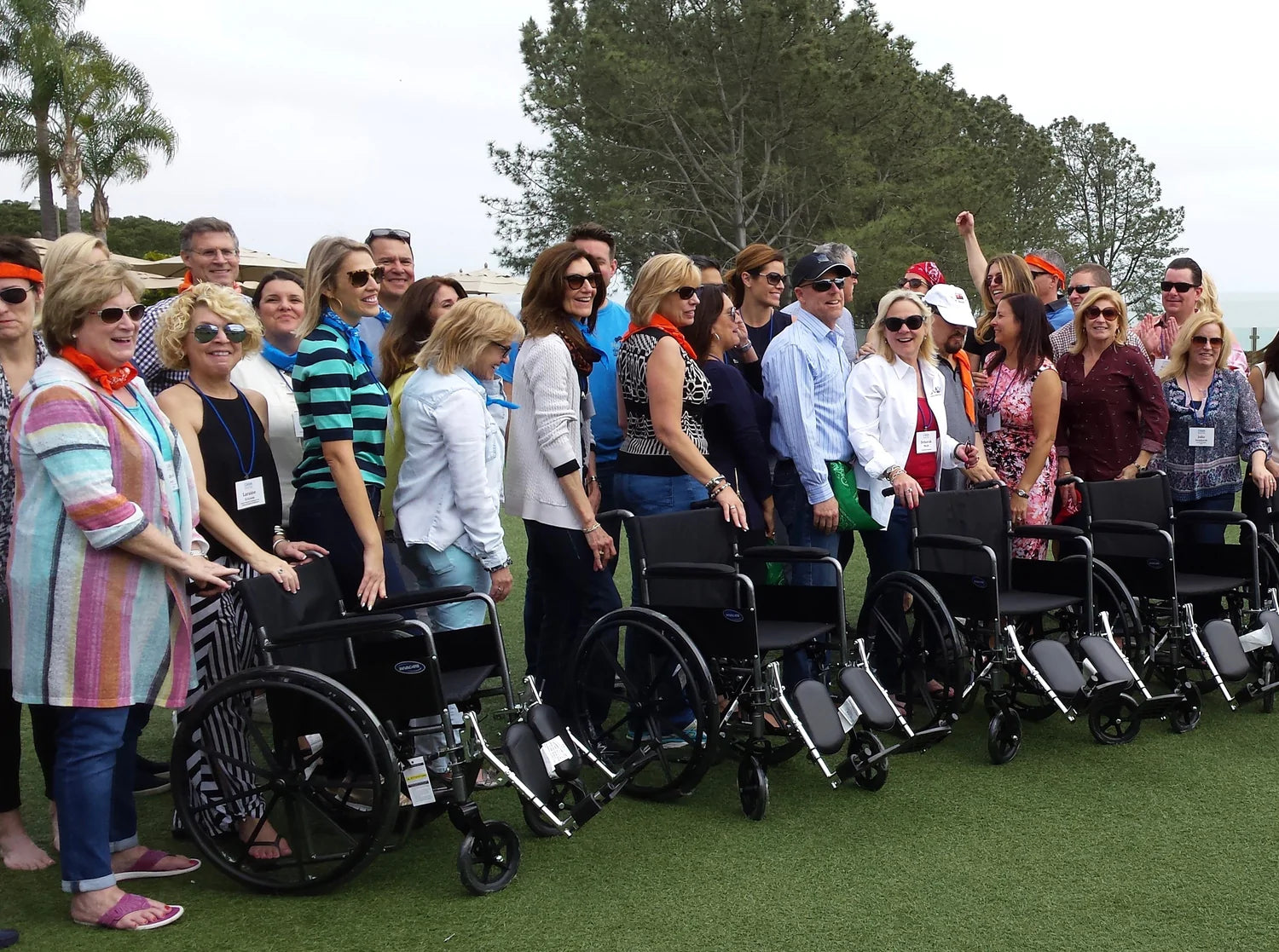 a group of people with wheelchairs in front of them
