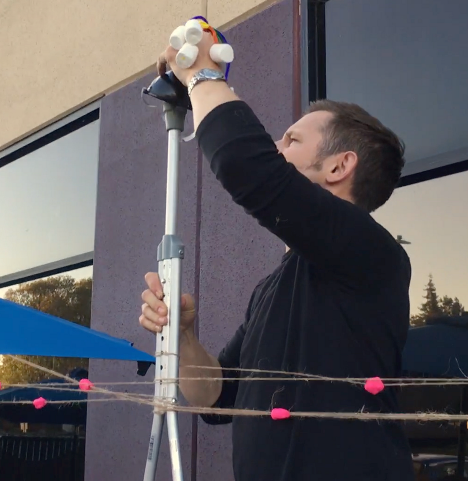 a person with marshmallows in their hand and a crutch