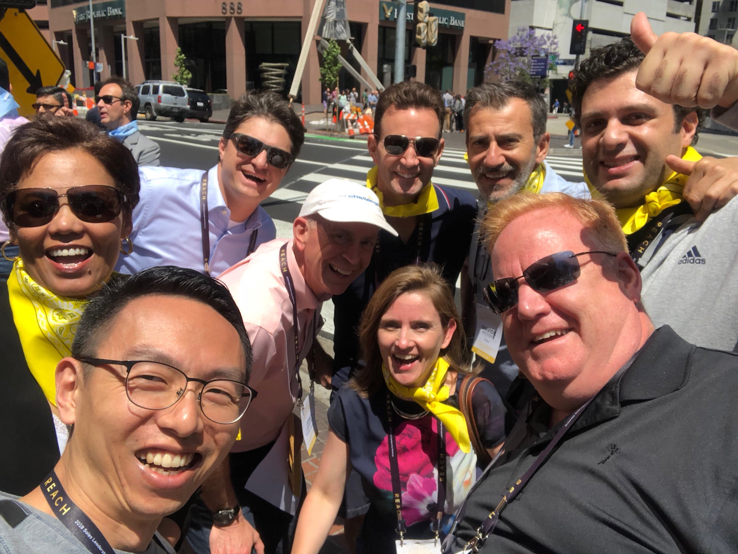 a group of people taking a selfie giving a thumbs up
